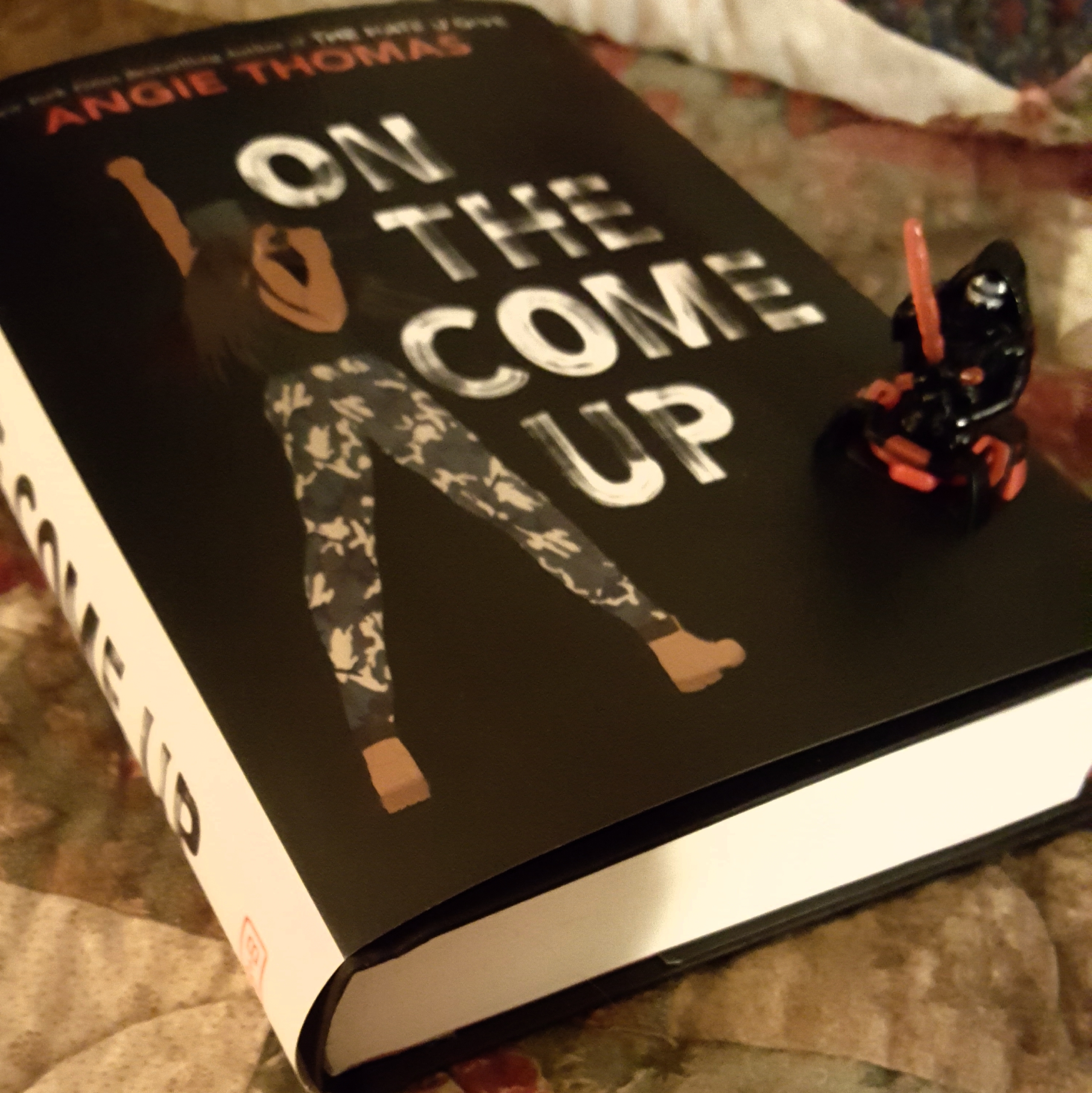 On the Come Up by Angie Thomas with a KinderJoy Star Wars toy